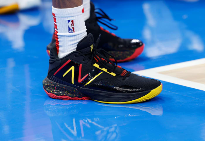 Atlanta Hawks guard Dejounte Murray's black and red New Balance sneakers.